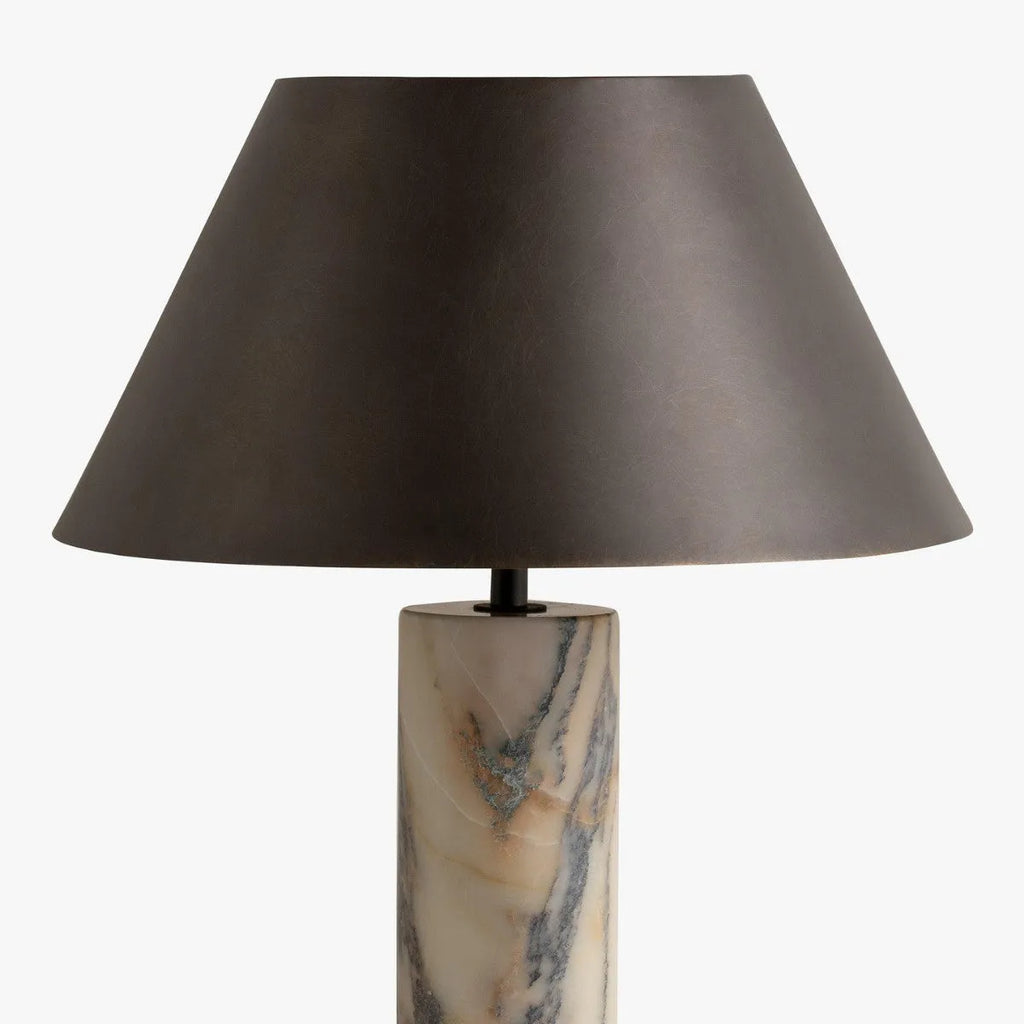 Black modern minimalist table lamp with a solid marble base on a wooden surface.