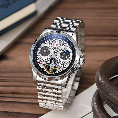 Automatic men's business watch with luminous hands on a steel bracelet.