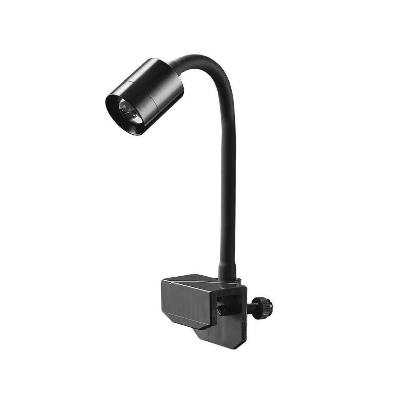 Mini LED aquarium light with clip mount next to a small fish bowl.