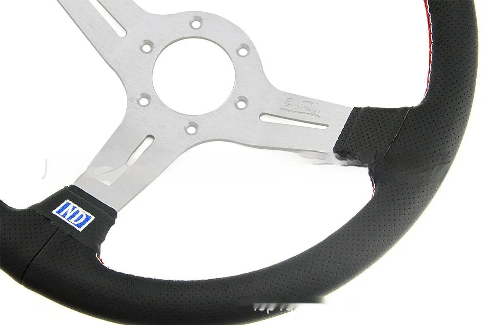 Leather-wrapped 14-inch steering wheel with a middle concave rim on a black metal skeleton.