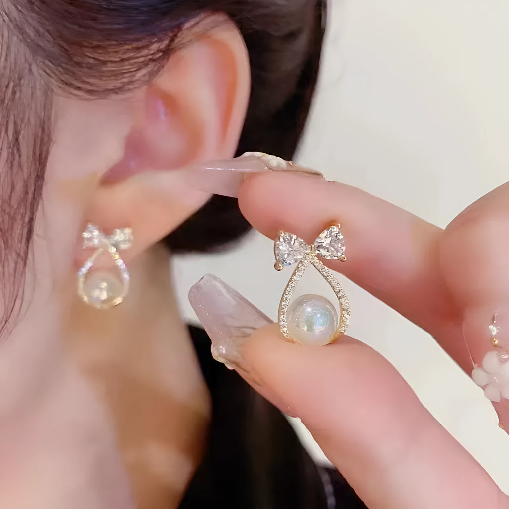 Women's alloy bow earrings with electroplating finish in colour as shown in main image