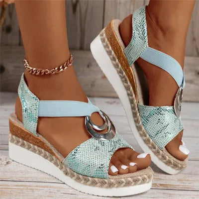 Women's peep toe serpentine wedge sandals, PU upper, in dark brown, shown on foot
