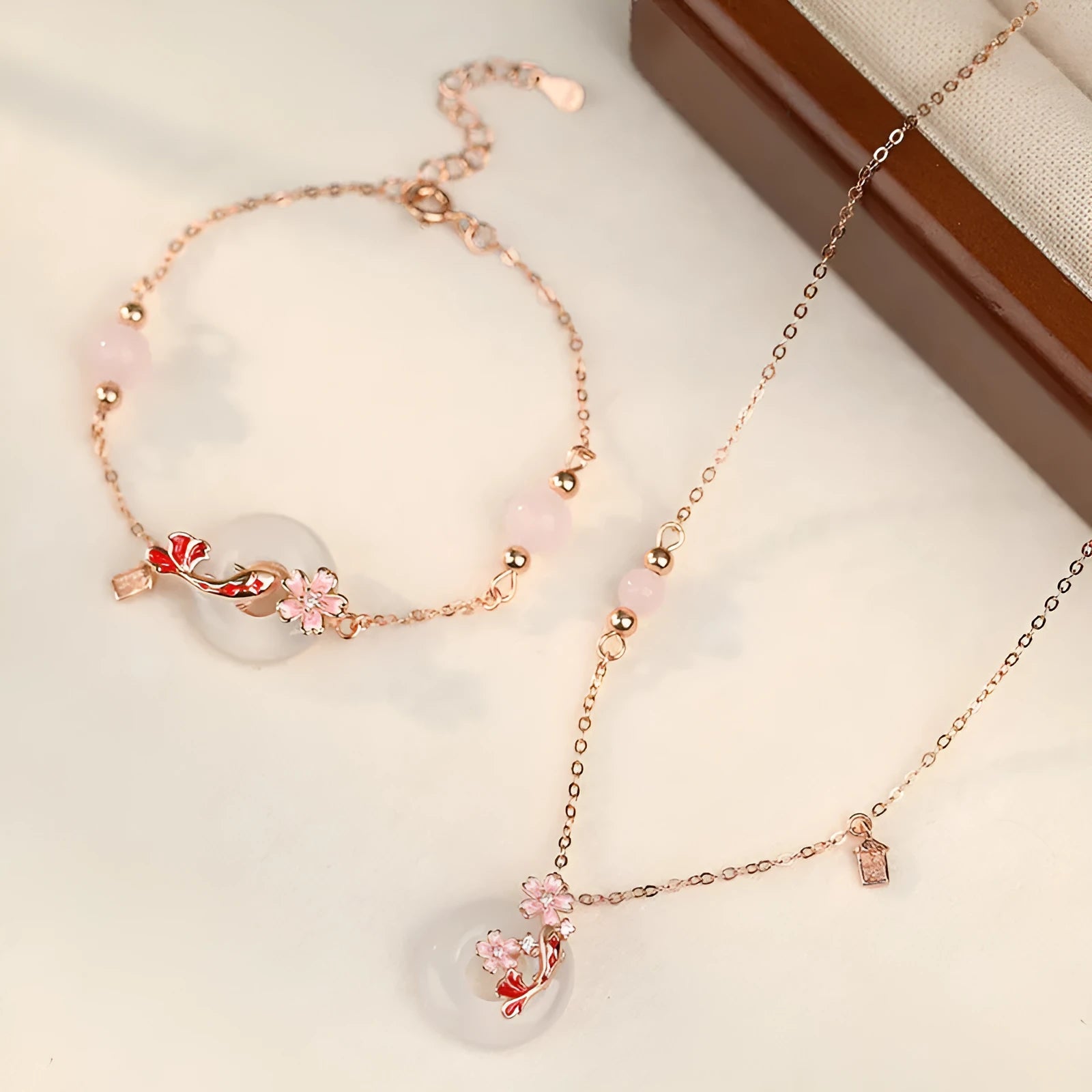 Women's S925 sterling silver bracelet with white chalcedony crystals and electroplated koi fish design.