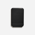 Magnetic mobile phone case holder in leather and fibreglass, shown in black, blue, green, and grey colour options.