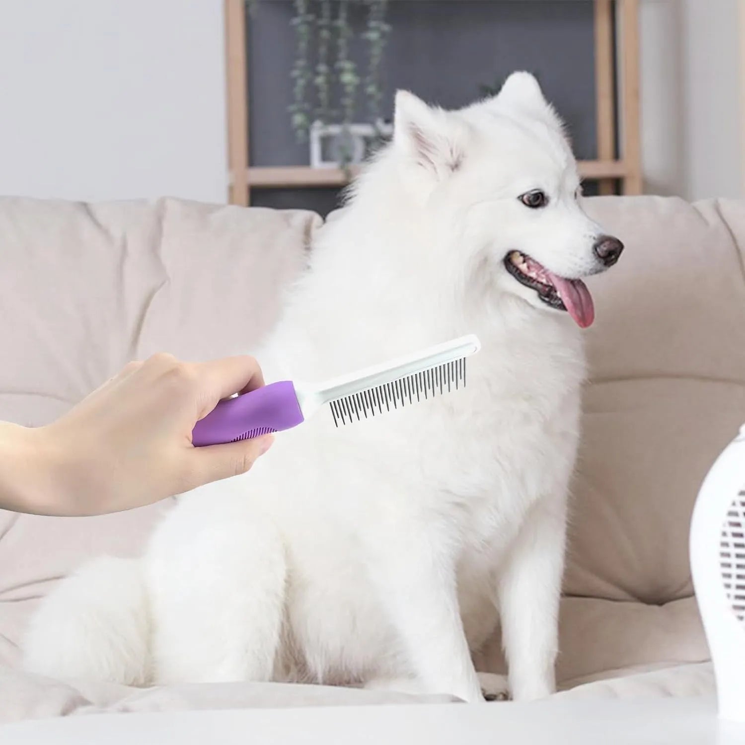 Purple pet grooming comb with stainless steel long and short teeth and an ergonomic handle.