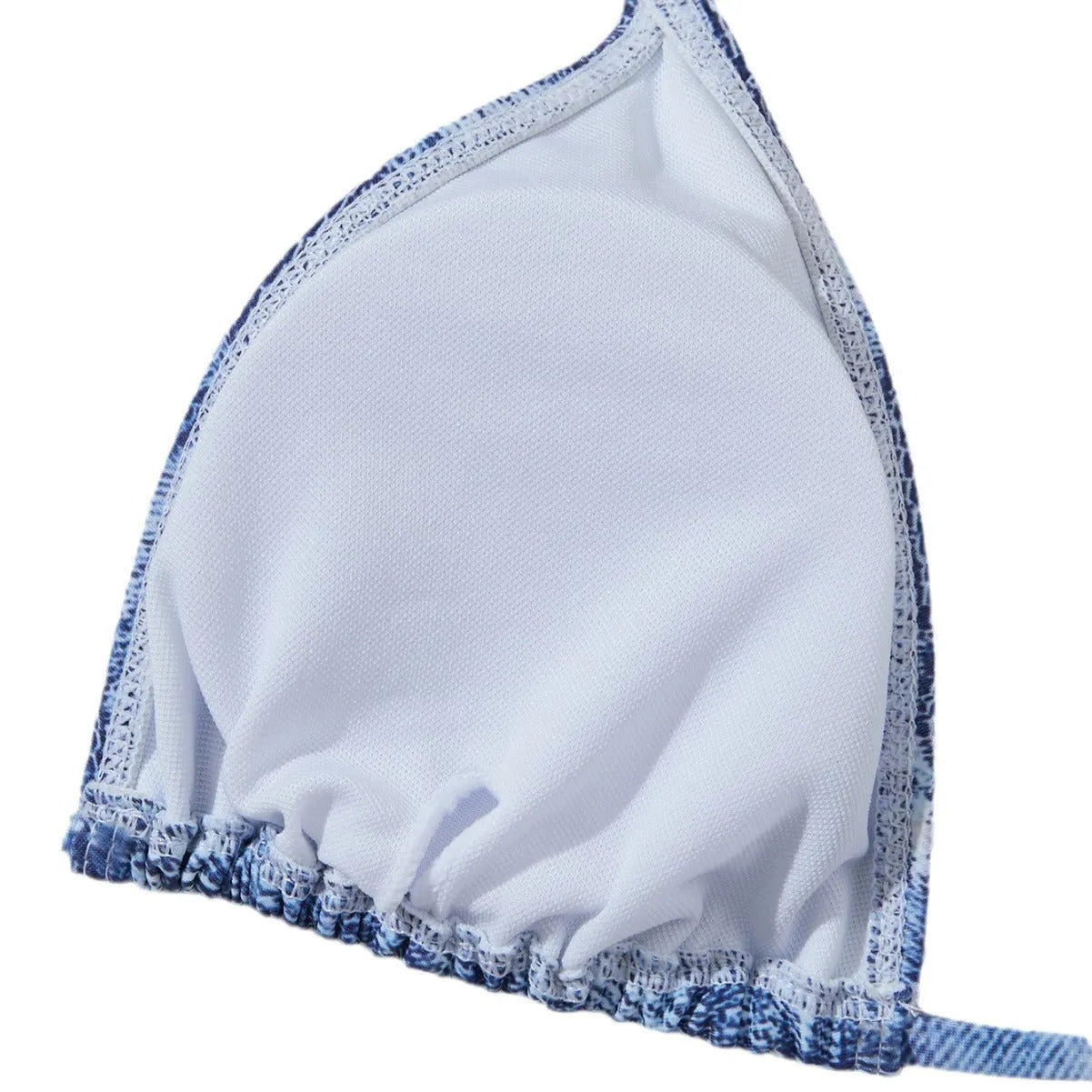 Denim blue printed women's two-piece bikini with thin straps, laid flat.