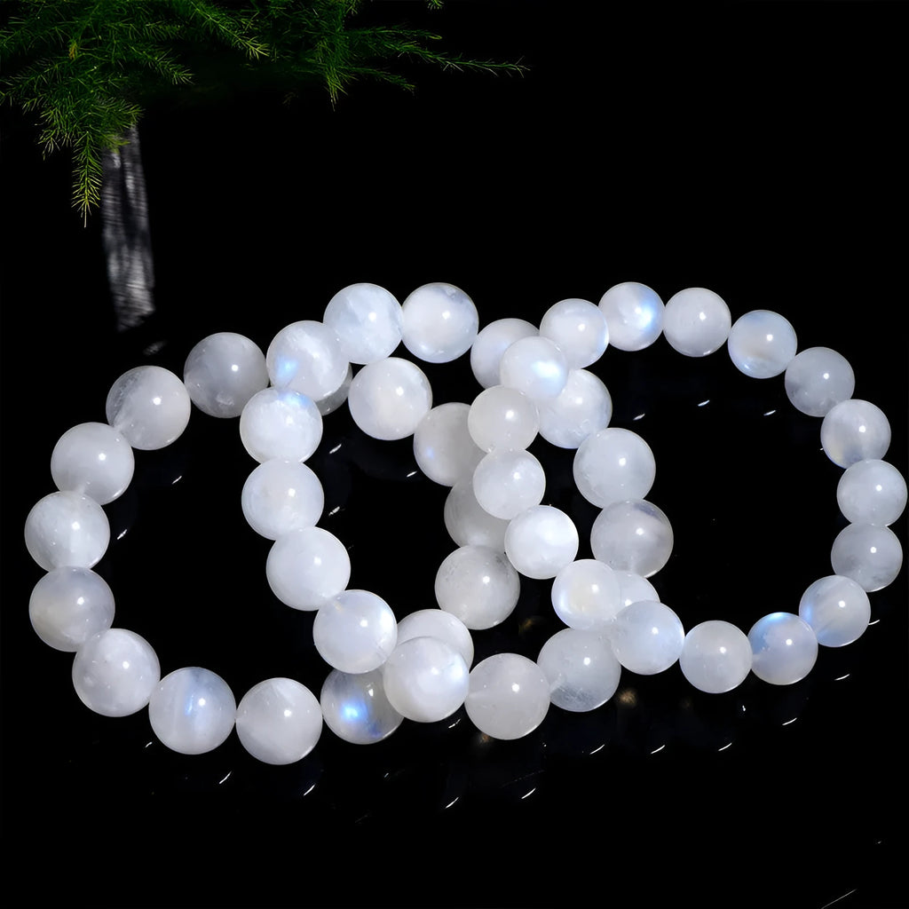 Natural blue moonlight round bead moonstone bracelet on a white background.