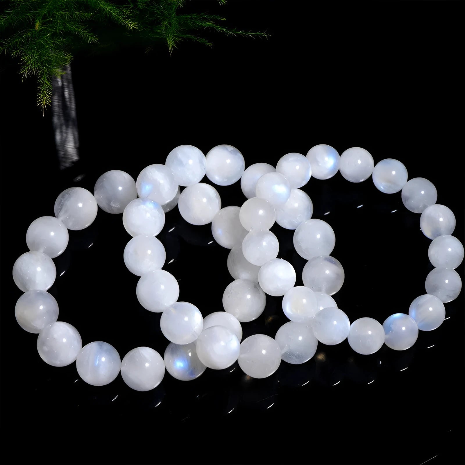 Natural blue moonlight round bead moonstone bracelet on a white background.