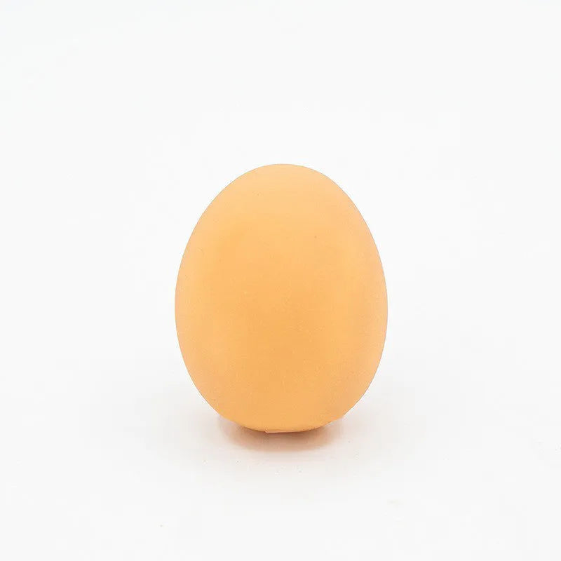 Realistic egg-shaped dog chew toy with textured surface and sound-emitting features for interactive pet play