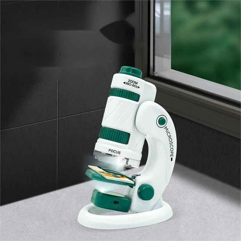 White and green portable plastic microscope kit with specimen slides for outdoor education.