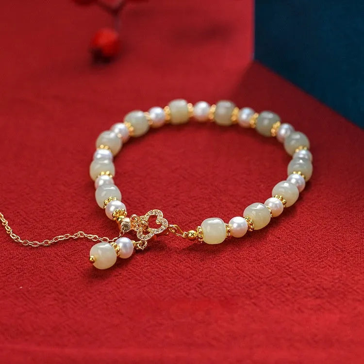 Gold-coloured Hetian jade bracelet with pearl pendant and Chinese style round beads