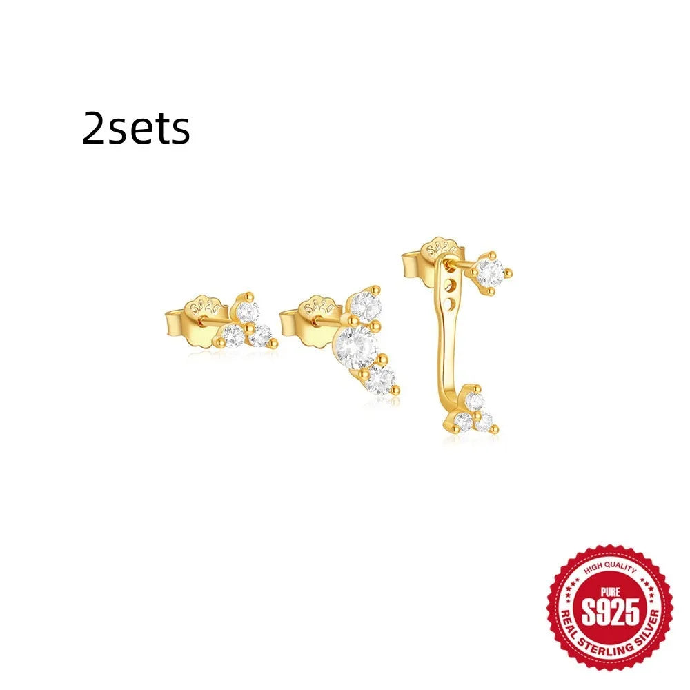 Set of three S925 sterling silver geometric zircon tassel earrings for women on a plain background.
