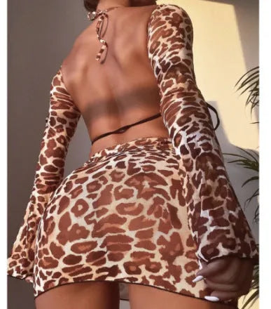 Women's leopard print split bikini swimsuit set with strapless top, high-waisted briefs, and matching skirt