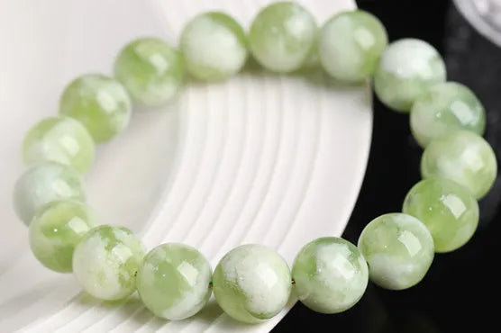 Green milk-in-water Xiuyan jade bracelet with polished finish and geometric unisex styling