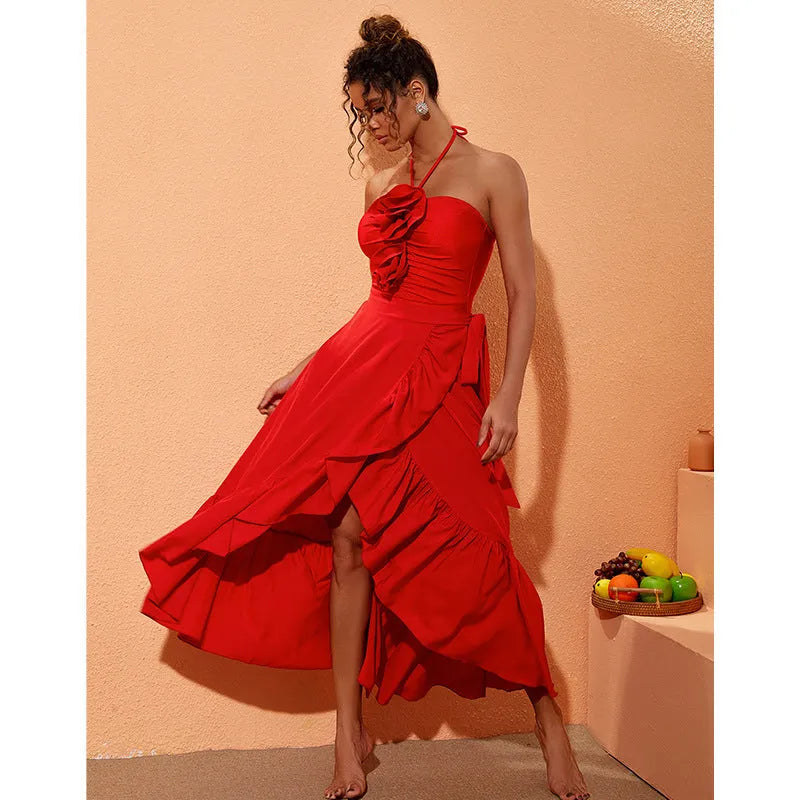 Red V-neck one-piece swimsuit with open back and a detachable long skirt laid flat.