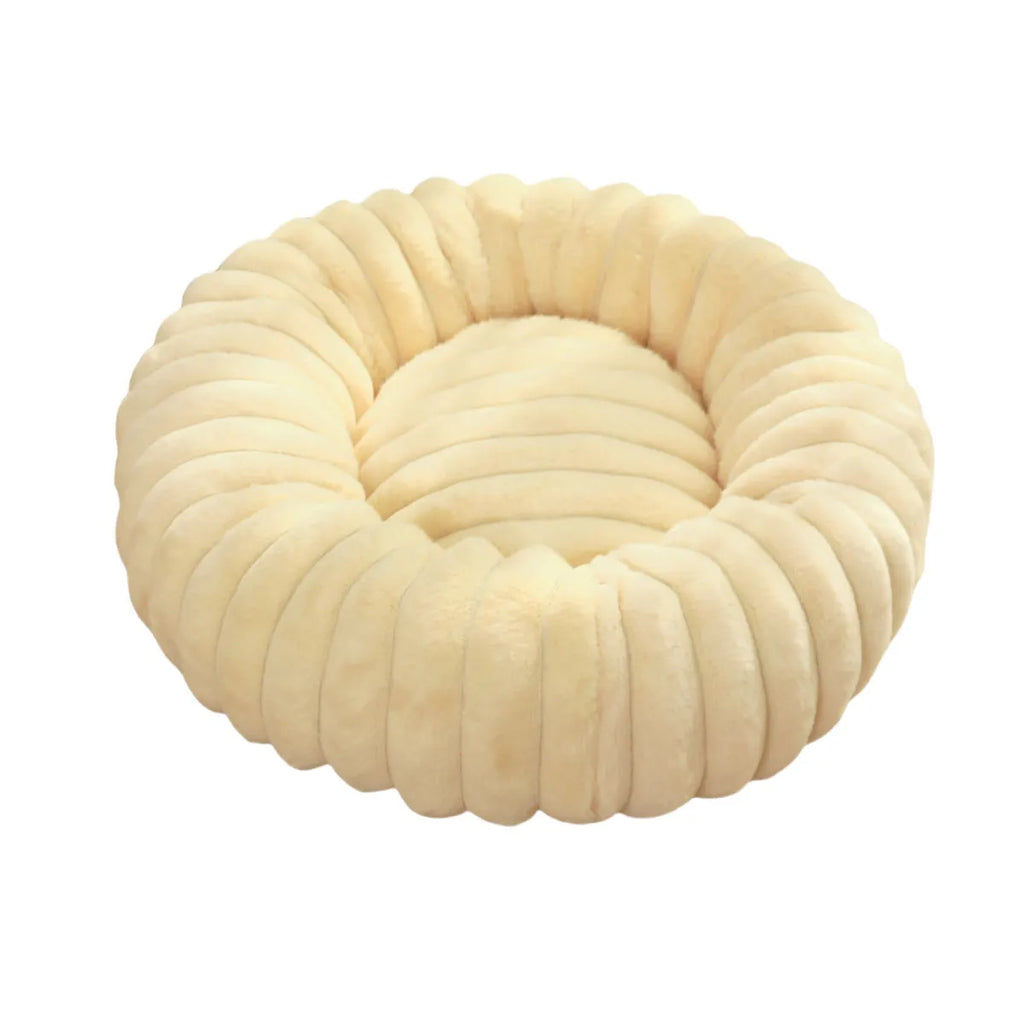 Round plush pet bed with long-hair rabbit fur style texture in beige colour