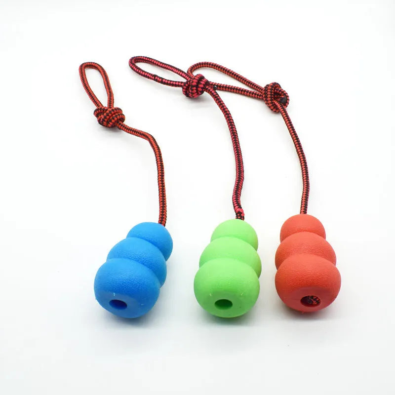 Rubber rope hoist pet toy with ball and rope in mixed colour hair, shown in 9cm small and 12cm large sizes