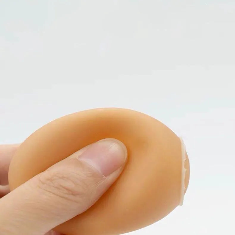 Realistic egg-shaped dog chew toy with textured surface and sound-emitting features for interactive pet play
