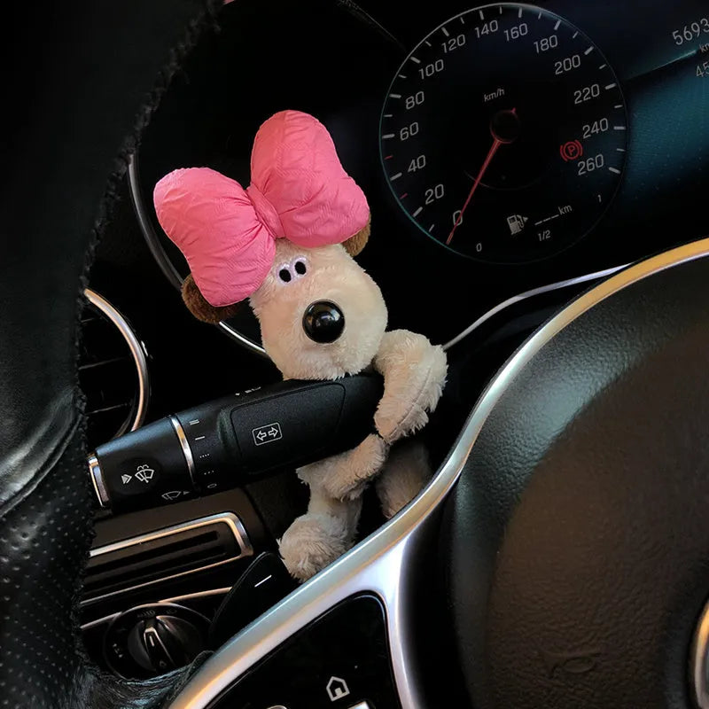 Cute cotton car decoration doll showing a pilot dog design on a dashboard.