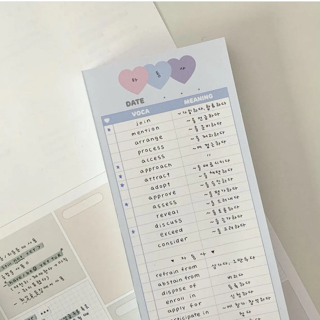 Vertical B5 half-size notepad with English words printed on paper, shown in pink, purple, and blue cover colours.