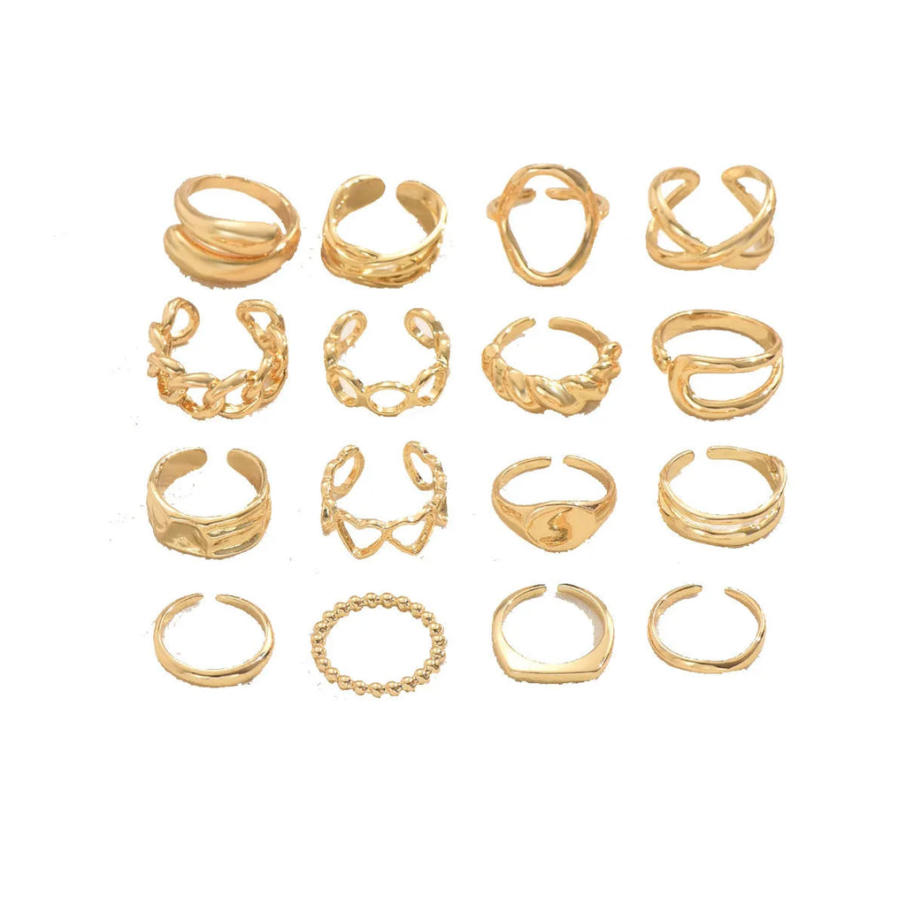 Women's 16-piece open ring suit in silver and gold zinc alloy geometric shape on display