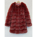 Women's long black artificial fur coat with regular sleeves, shown on a hanger.