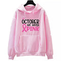 I'm A Survivor retro graphic hoodie in pink colour with side seam pockets, showing long-sleeve pullover design.