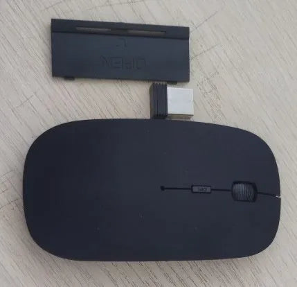 Bluetooth dual-mode wireless mouse in grey with mute buttons and 15cm USB charging cable