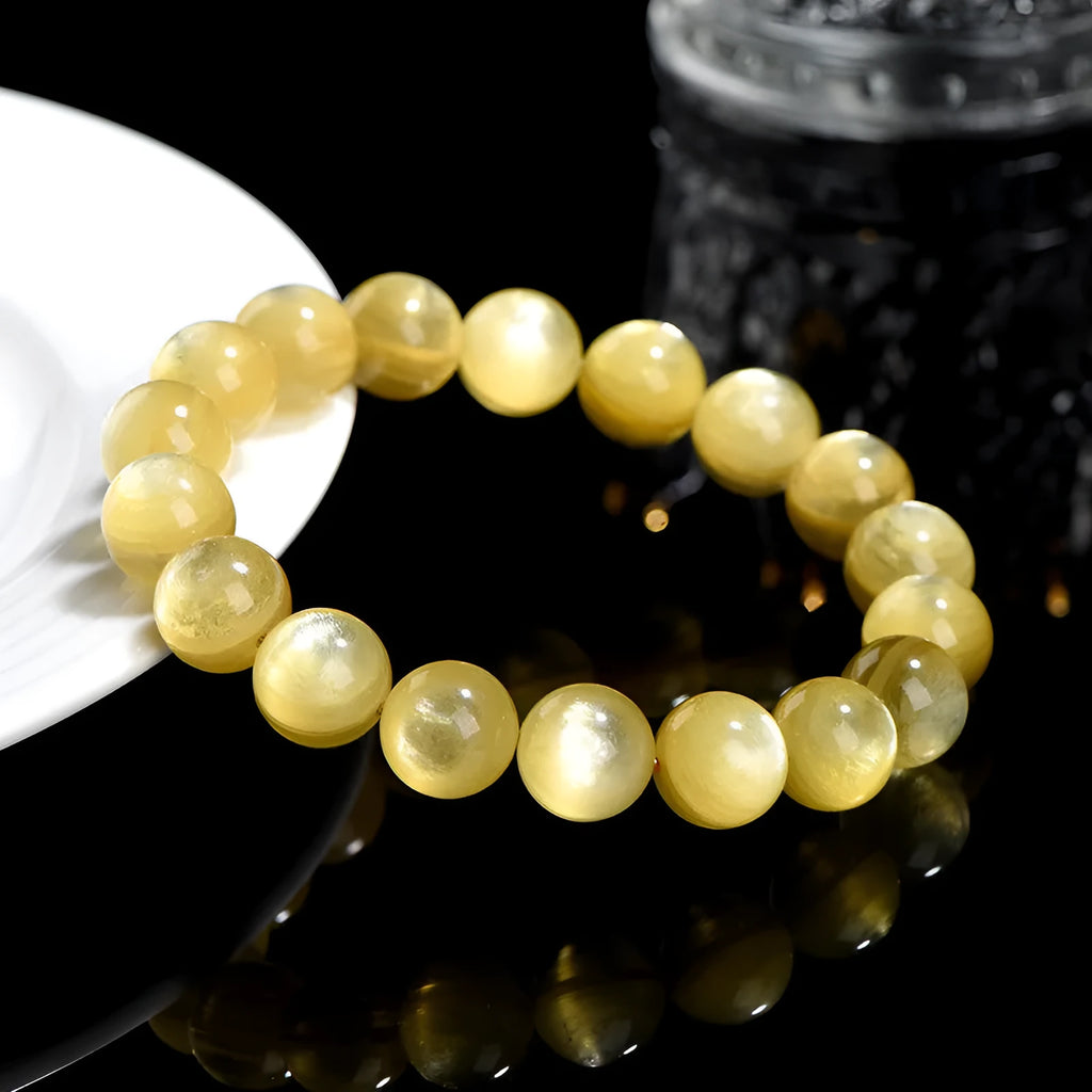 Handmade yellow lepidolite mica bead bracelet with geometric shapes and polished finish