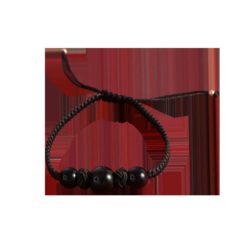 Red woven rope bracelet with spherical strawberry quartz beads and alloy accents