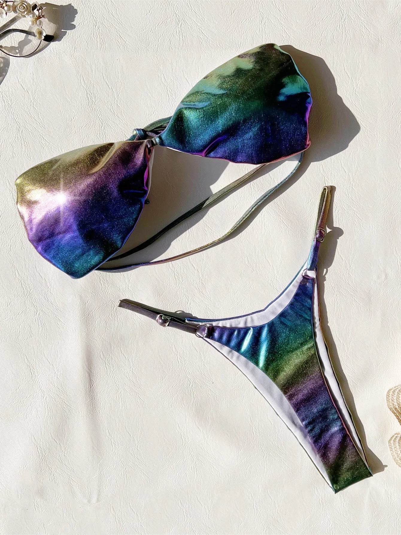 Women's gradient purple bikini swimsuit on a mannequin, showing the colour transition.