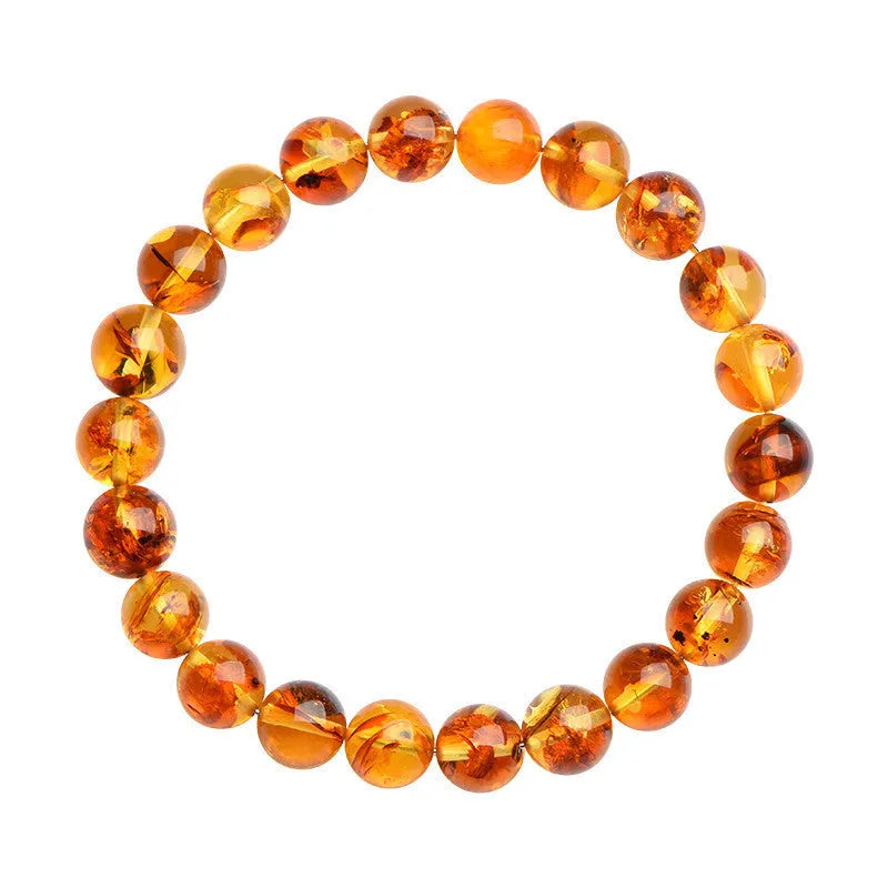 Natural yellow piebald amber bracelet with geometric polished beads.