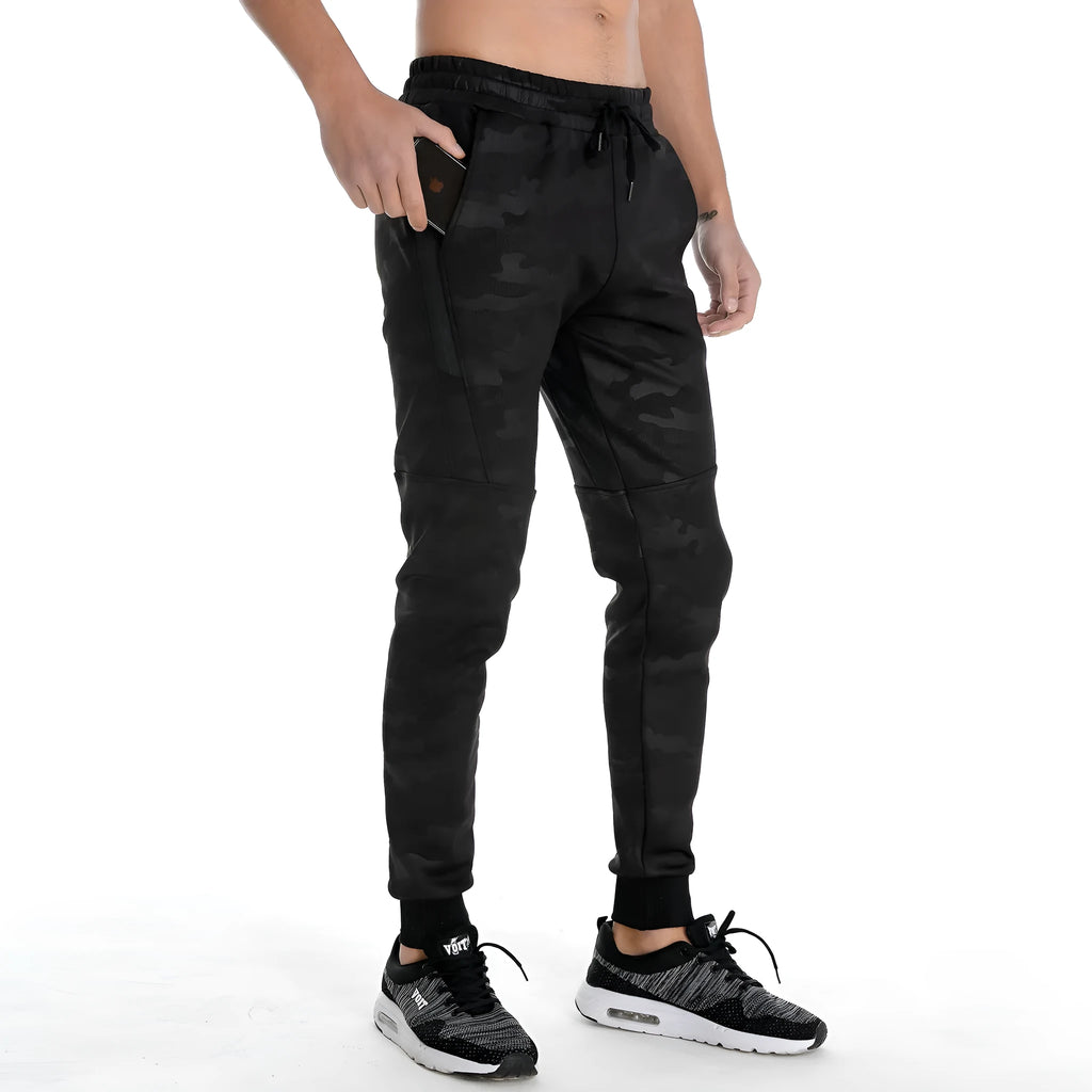 Men's camouflage printed jogging pants in cotton, loose fit, mid-waisted, available in five colours.