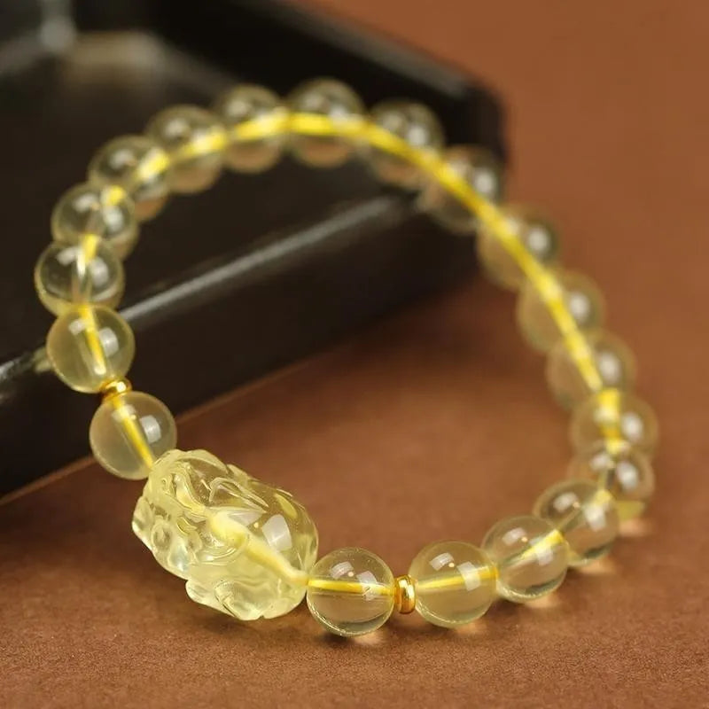 Yellow leather citrine pi xiu bracelet with artificial crystal bead in Chinese national style.