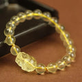 Yellow leather citrine pi xiu bracelet with artificial crystal bead in Chinese national style.