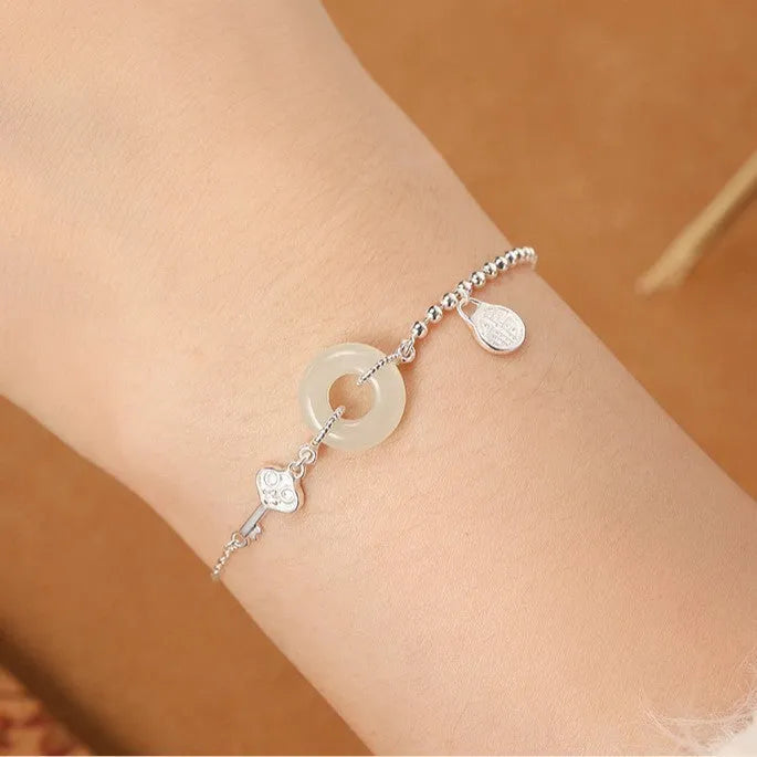 Women's Chinese style Hetian jade bracelet in 925 silver with geometric design and electroplated finish