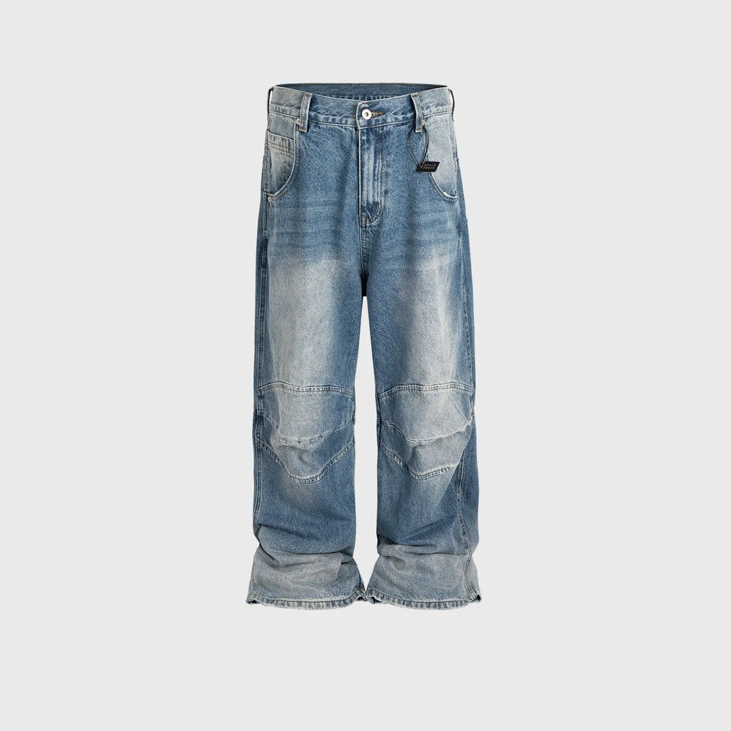 Men's washed blue baggy jeans with pleated front detail and straight-leg cut