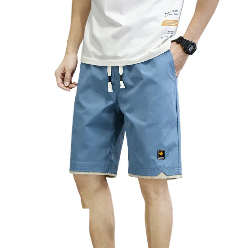 Men's loose-fit straight-leg beach shorts in polyester, shown in a khaki colour.