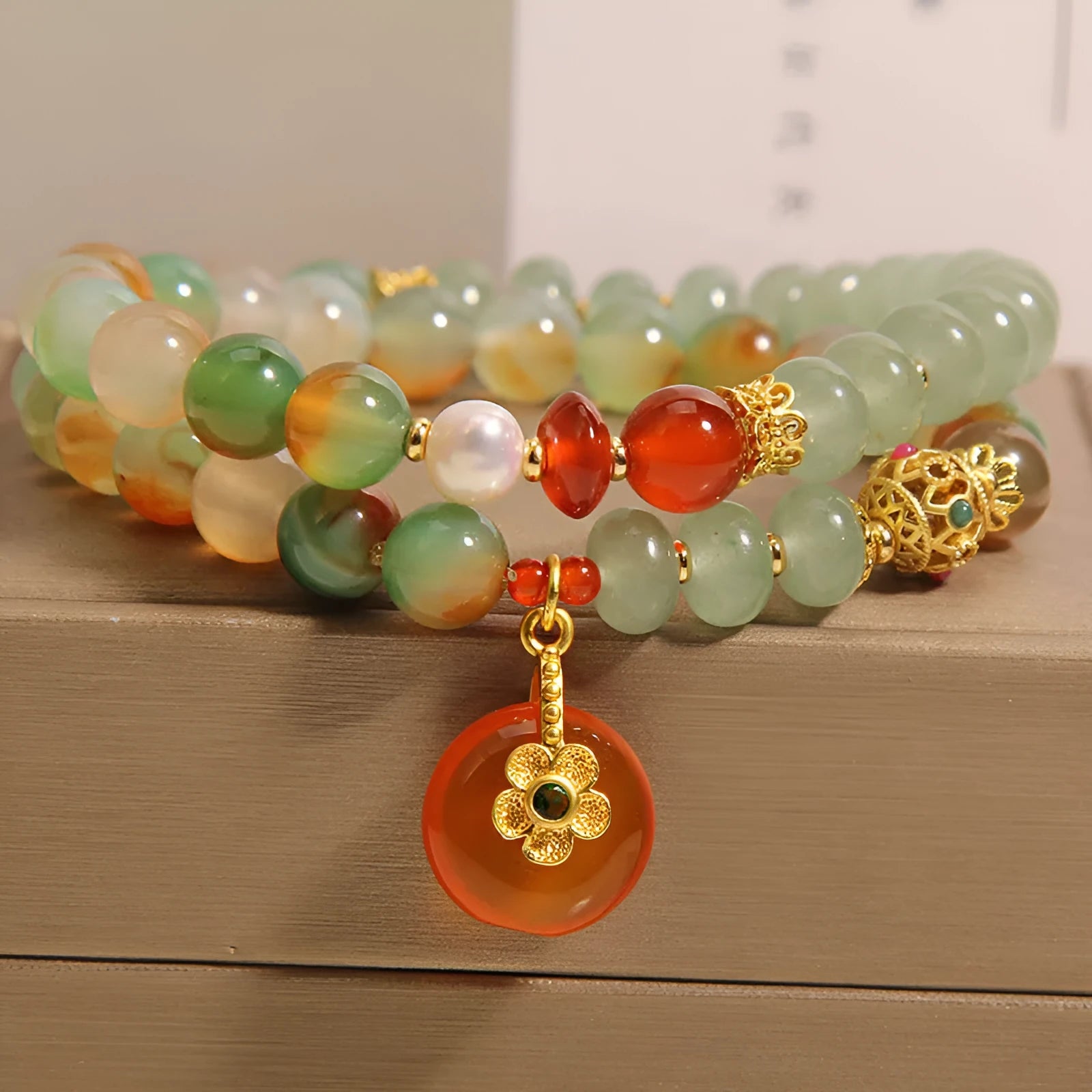 Women's peacock green agate double ring bracelet with safety buckle closure and rhinestone accents