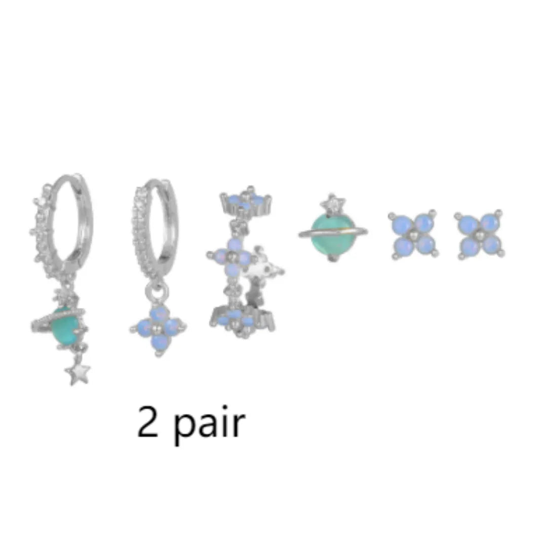 Gold and silver floral ear studs with zircon mosaic details in Japanese Korean style.