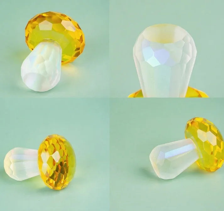Colourful geometric crystal mushroom decoration in transparent, green, red, or yellow, 40mm by 53mm.