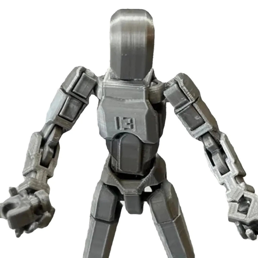 3D printed multi-jointed robot action figure model with movable joints on a desk.