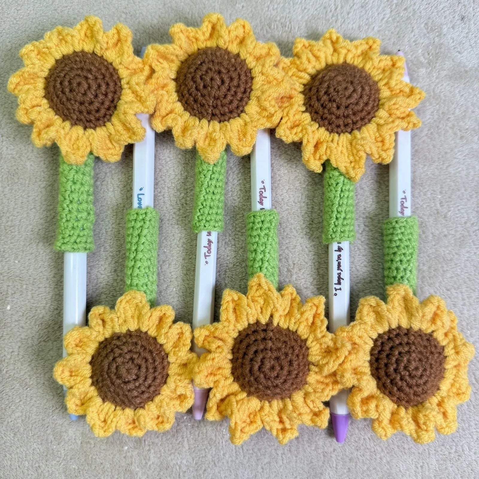 Hand-woven sunflower pen cover for teachers with crochet construction