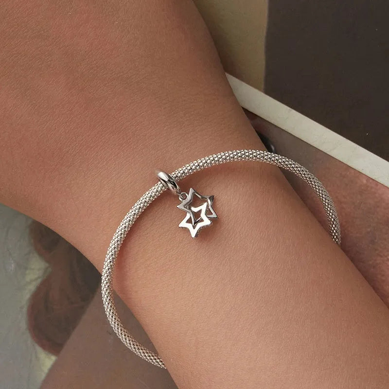 Single S925 sterling silver starlight bead 2.4cm tall with 0.45cm aperture on white background
