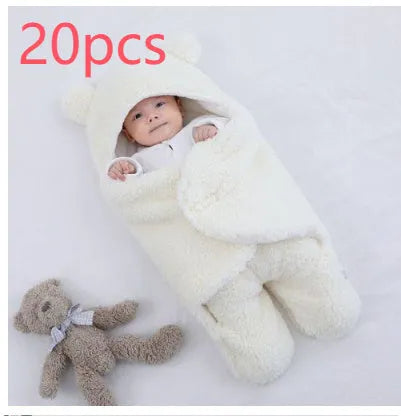 Cotton blend baby quilted sleeping bag wrapper in light blue, shown with size labels for 3M, 6M, and 9M.