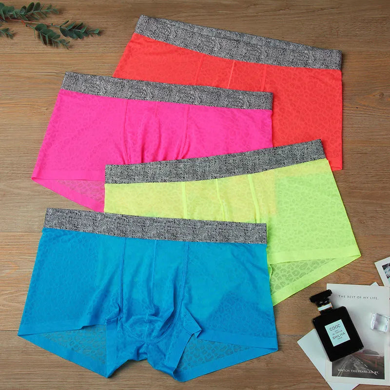 Men's seamless lace boxer briefs in a thin jacquard weave, shown in a solid colour with a low-waist design.