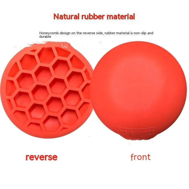 Orange golf centre of gravity training mat on practice surface