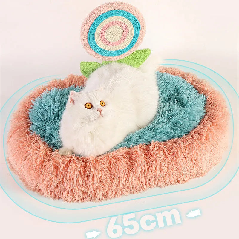 Pink thick plush elliptical cat bed with a deep, lollipop-shaped nest for cats.
