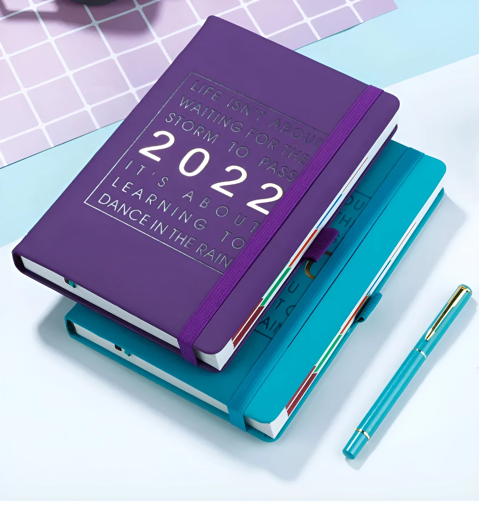 A5 imitation leather notebook with French fold binding open flat on a desk, seven colour options