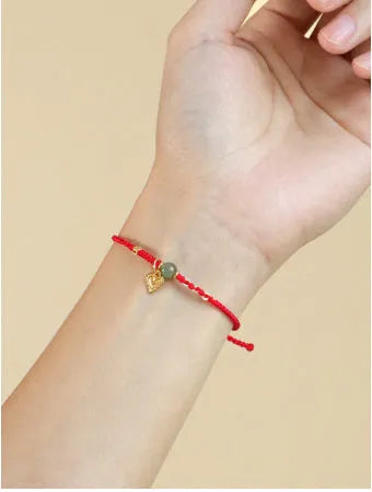 Handmade 925 silver bracelet with Hetian jade stone in woven design, available in red or dark red strap options